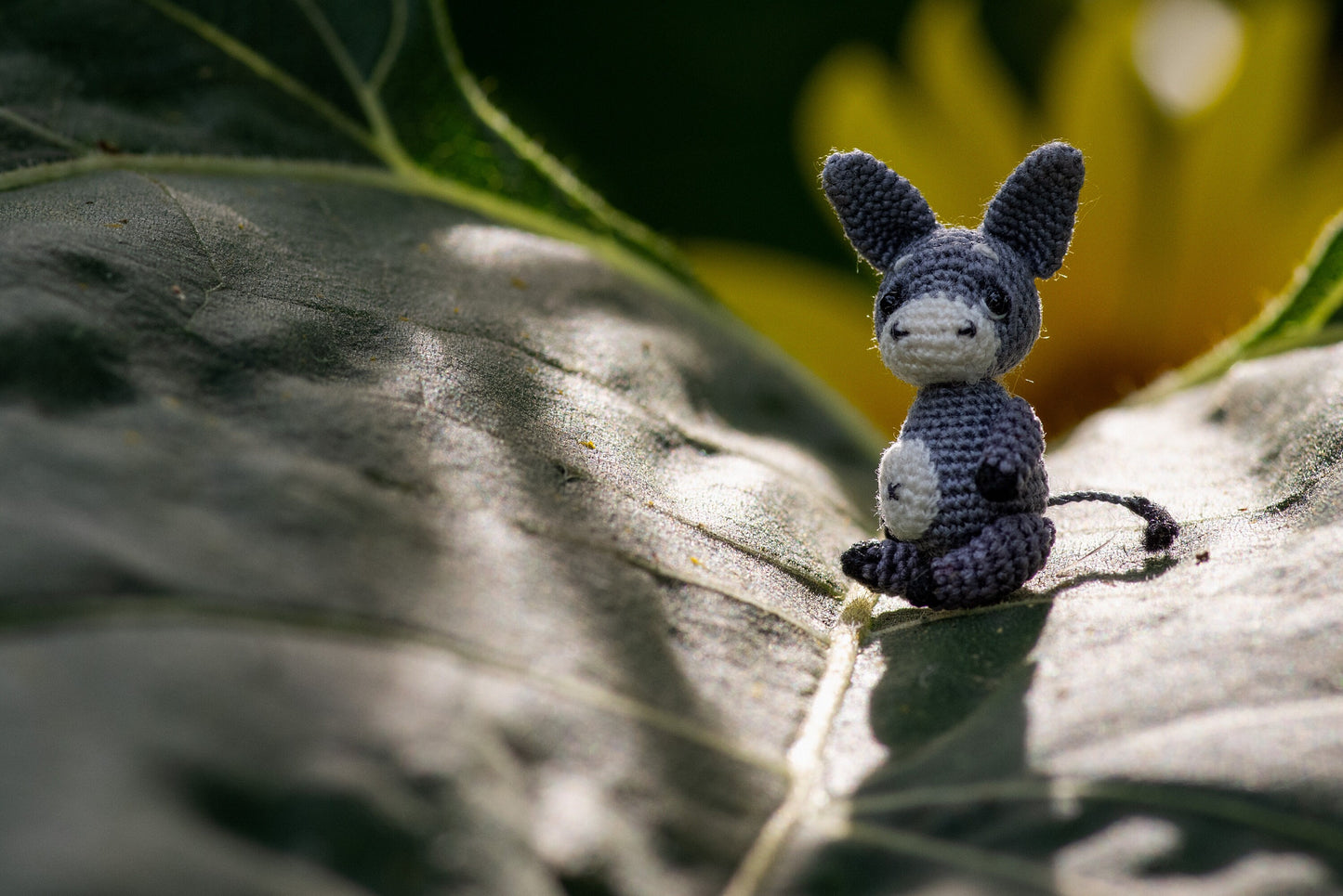 TaleWorld donkey resting in walnut shell – micro collectible for shelf display