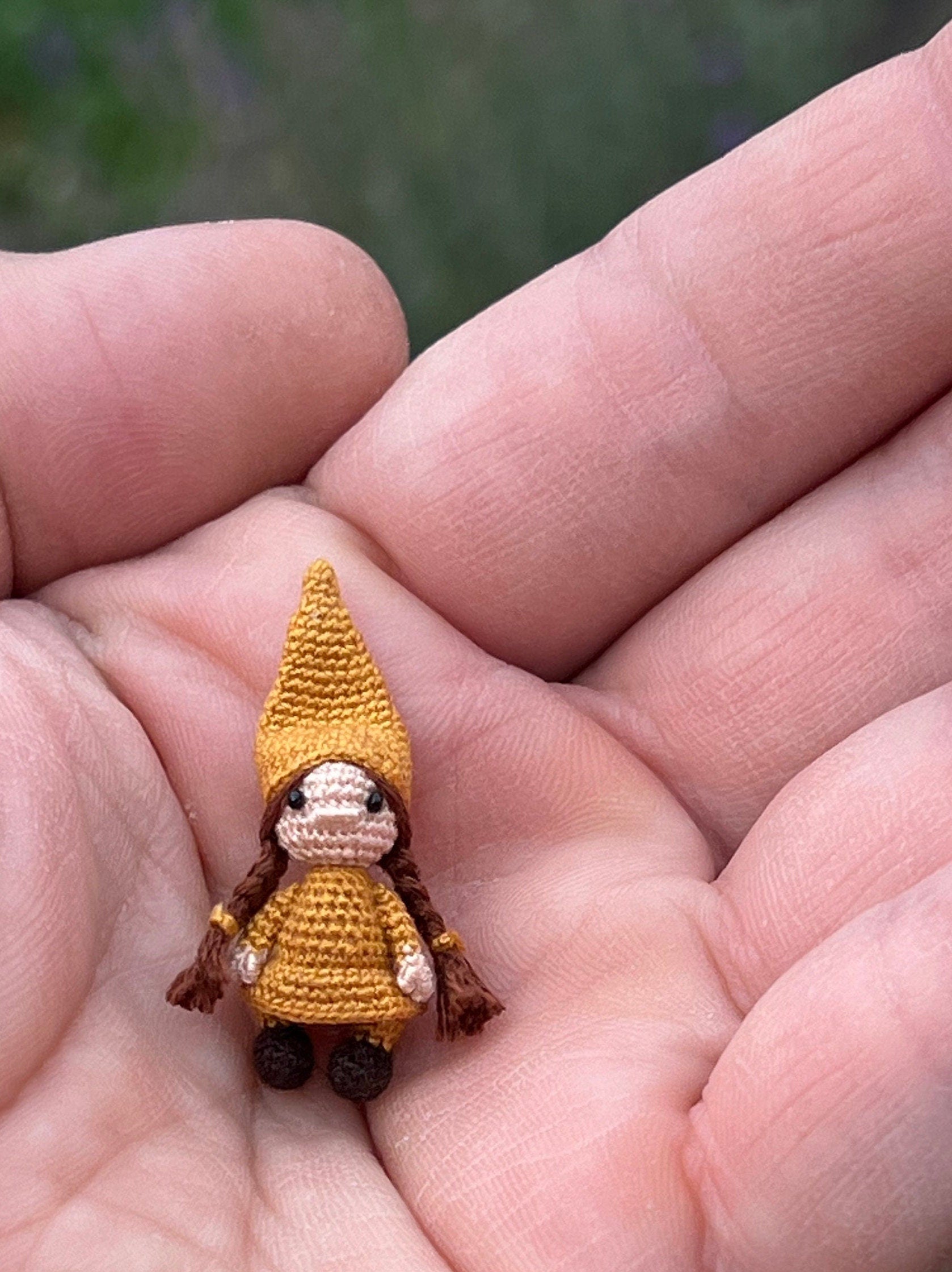Tiny handmade gnome girl in mustard yellow hat held in hand, TaleWorld doll
