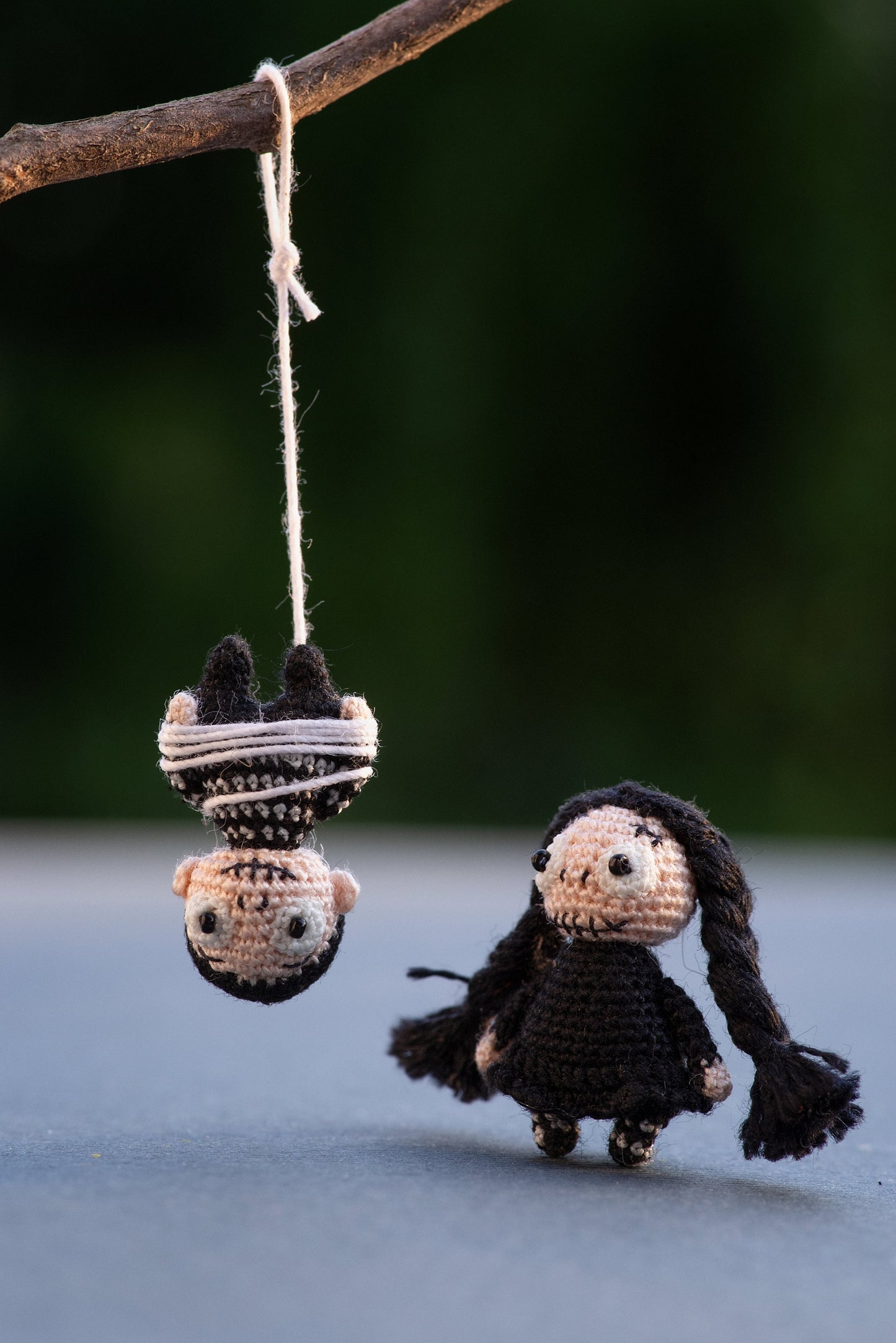Wednesday-style crochet amigurumi with expressive eyes and moody atmosphere