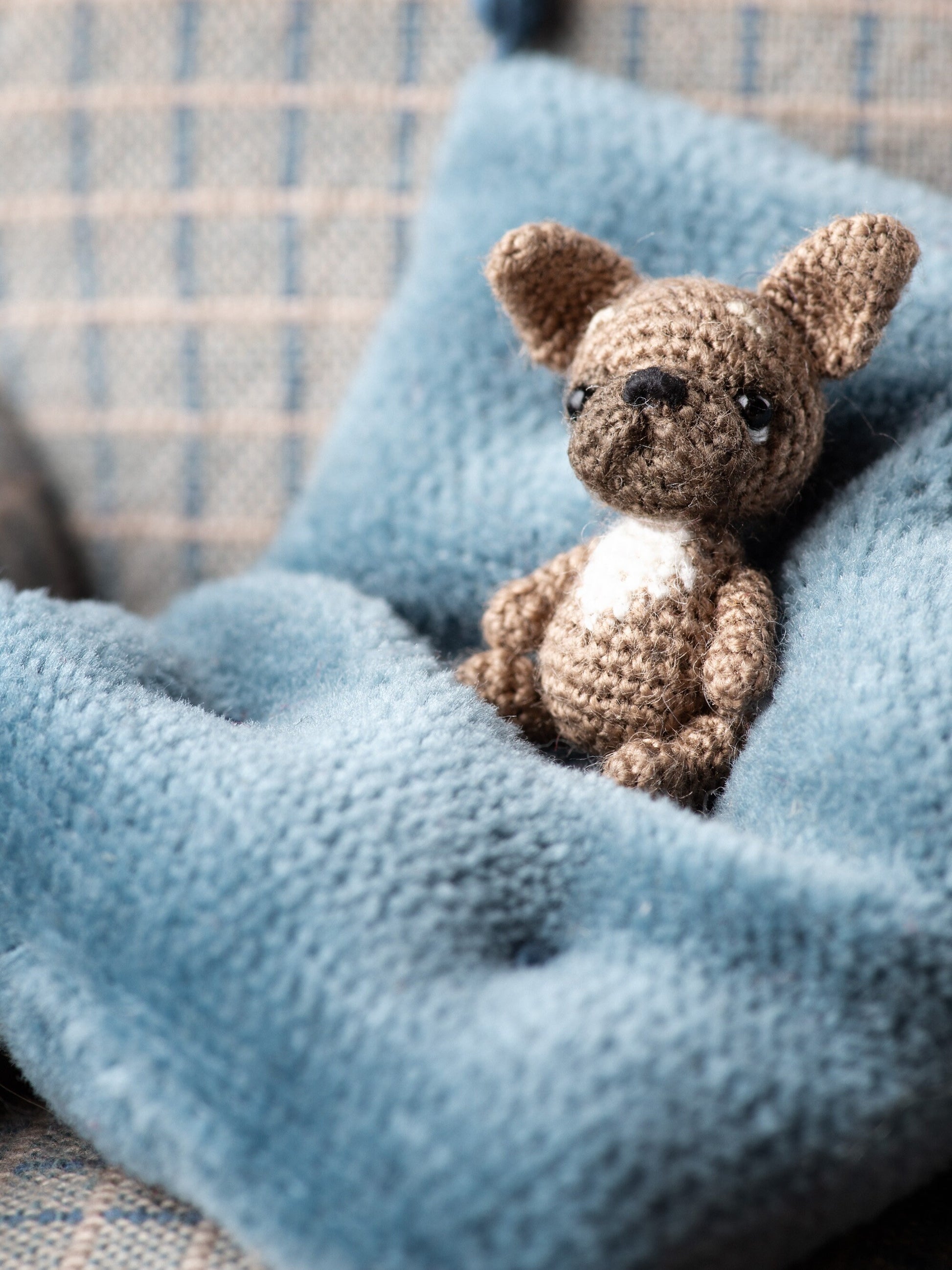 Small crochet puppy figure with upright ears