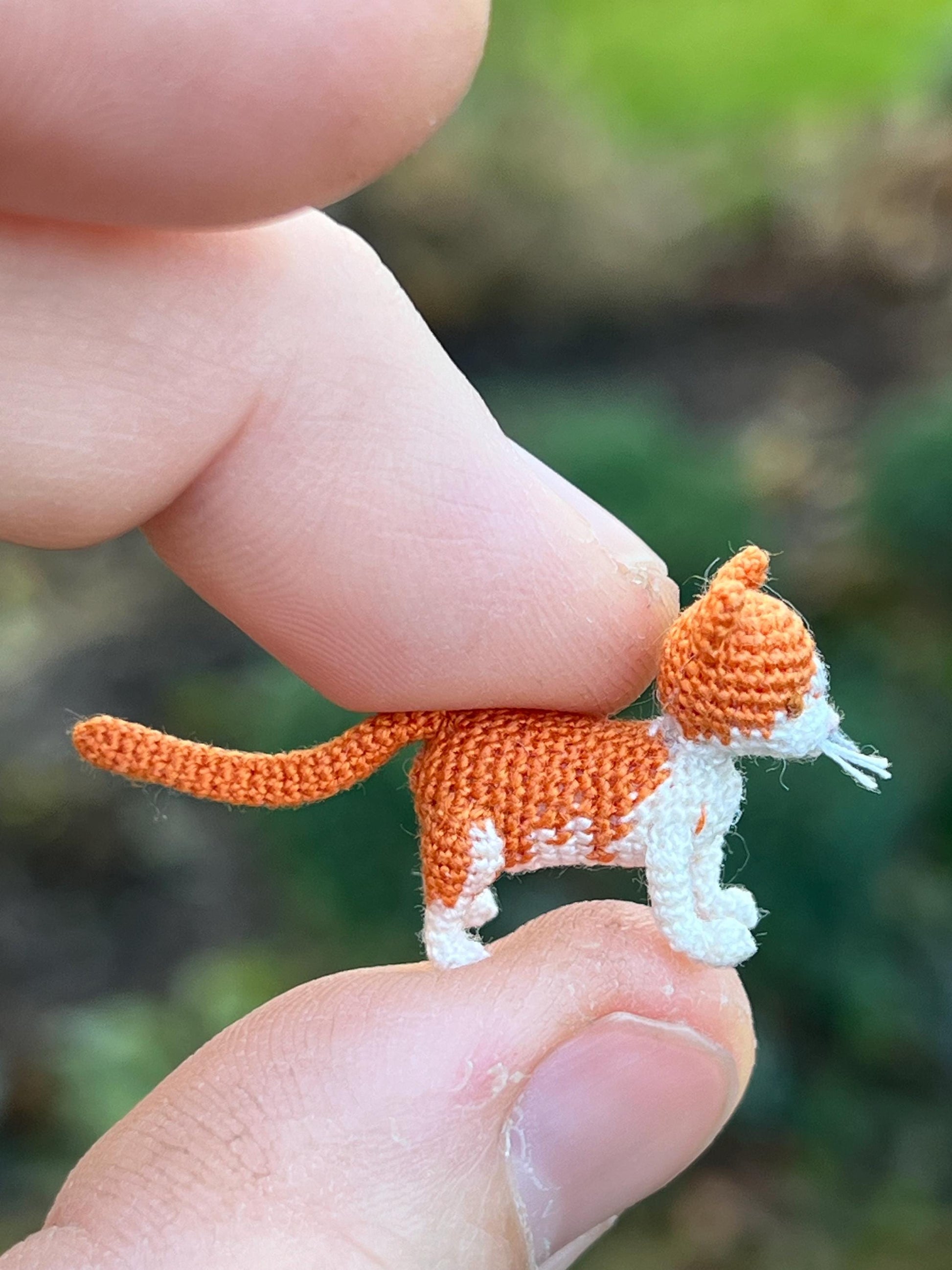 Miniature orange and white amigurumi kitty figurine