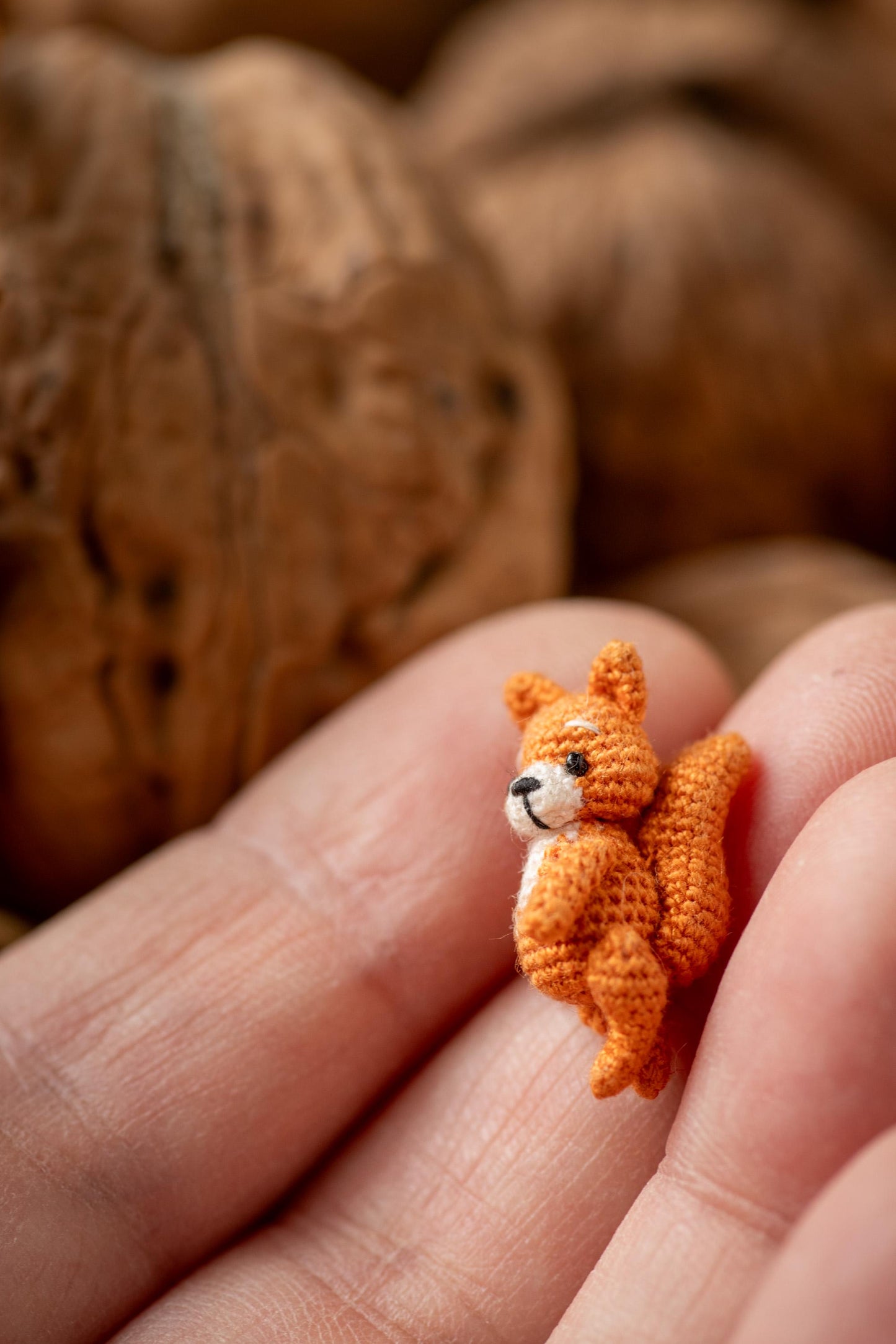 Handmade forest animal figurine on palm