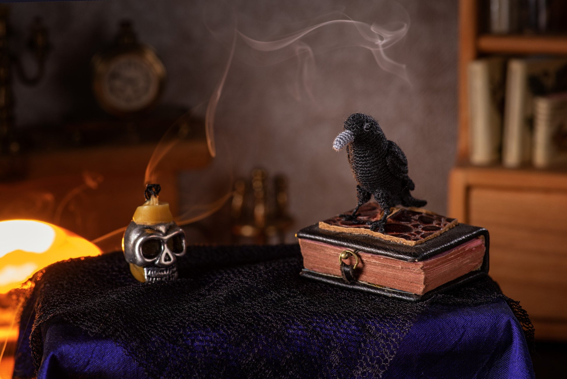 Crochet raven toy with grey beak in dark magical room, TaleWorld miniature decor