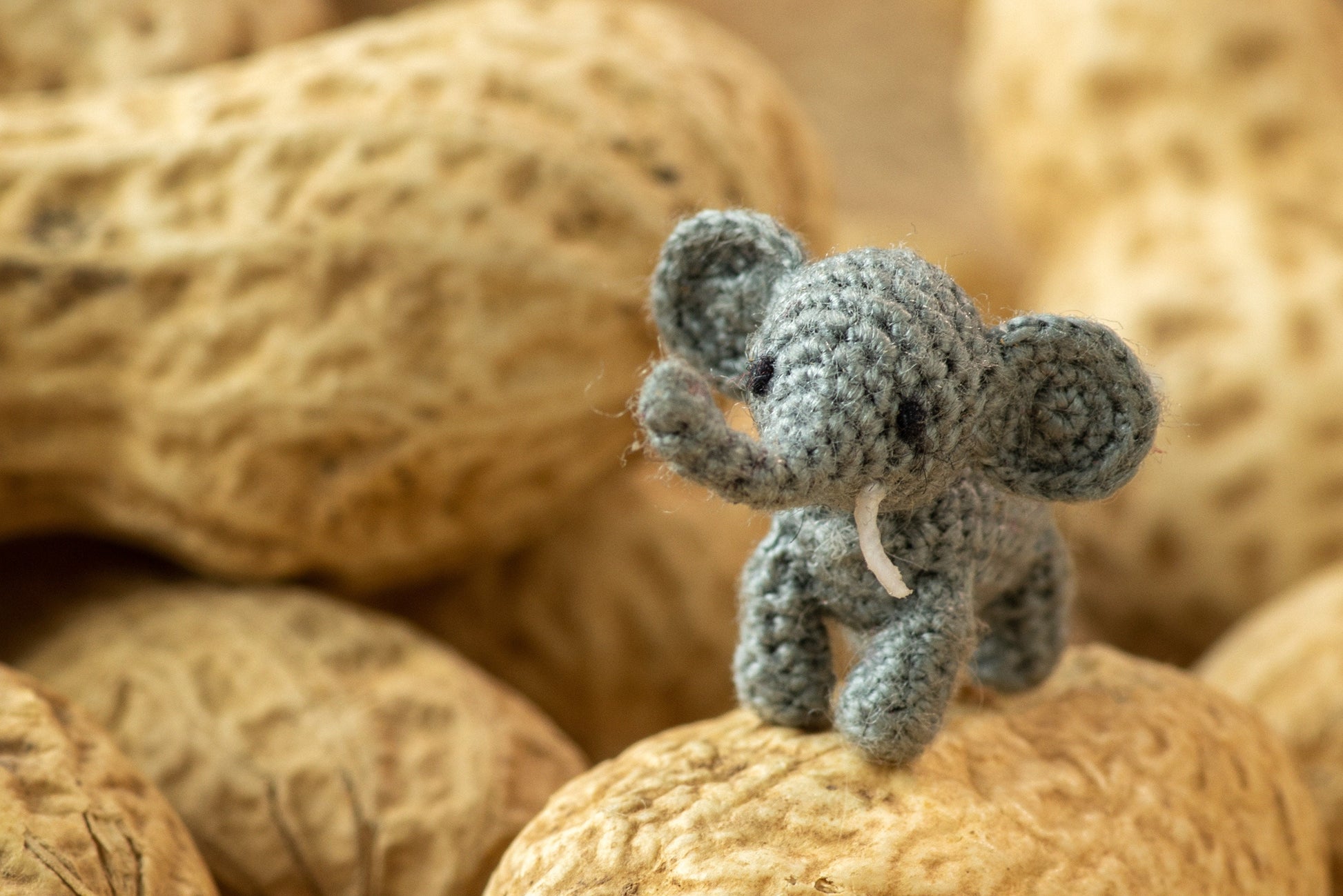  Small handmade elephant on textured surface