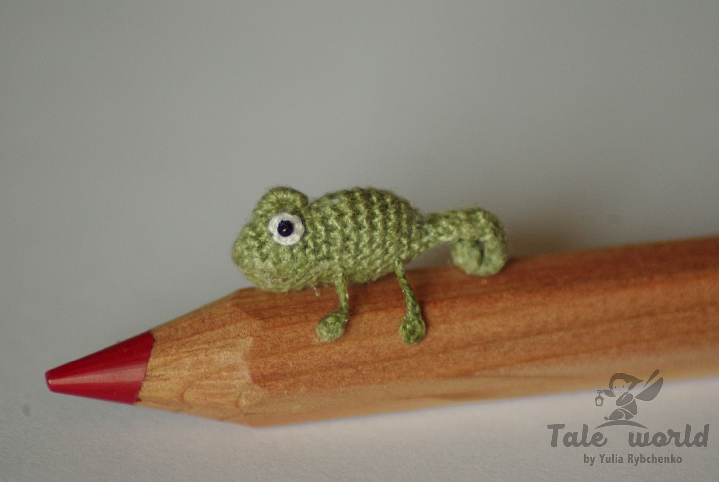 Small crocheted jungle chameleon animal close-up