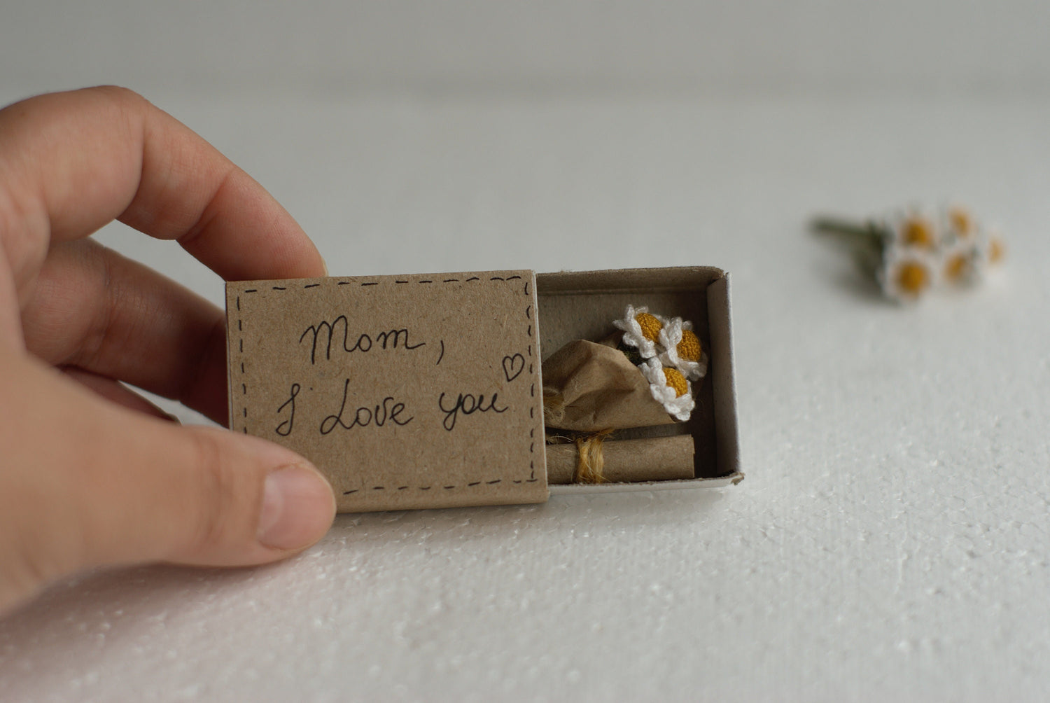 Miniature gift box for mom with tiny crocheted daisies