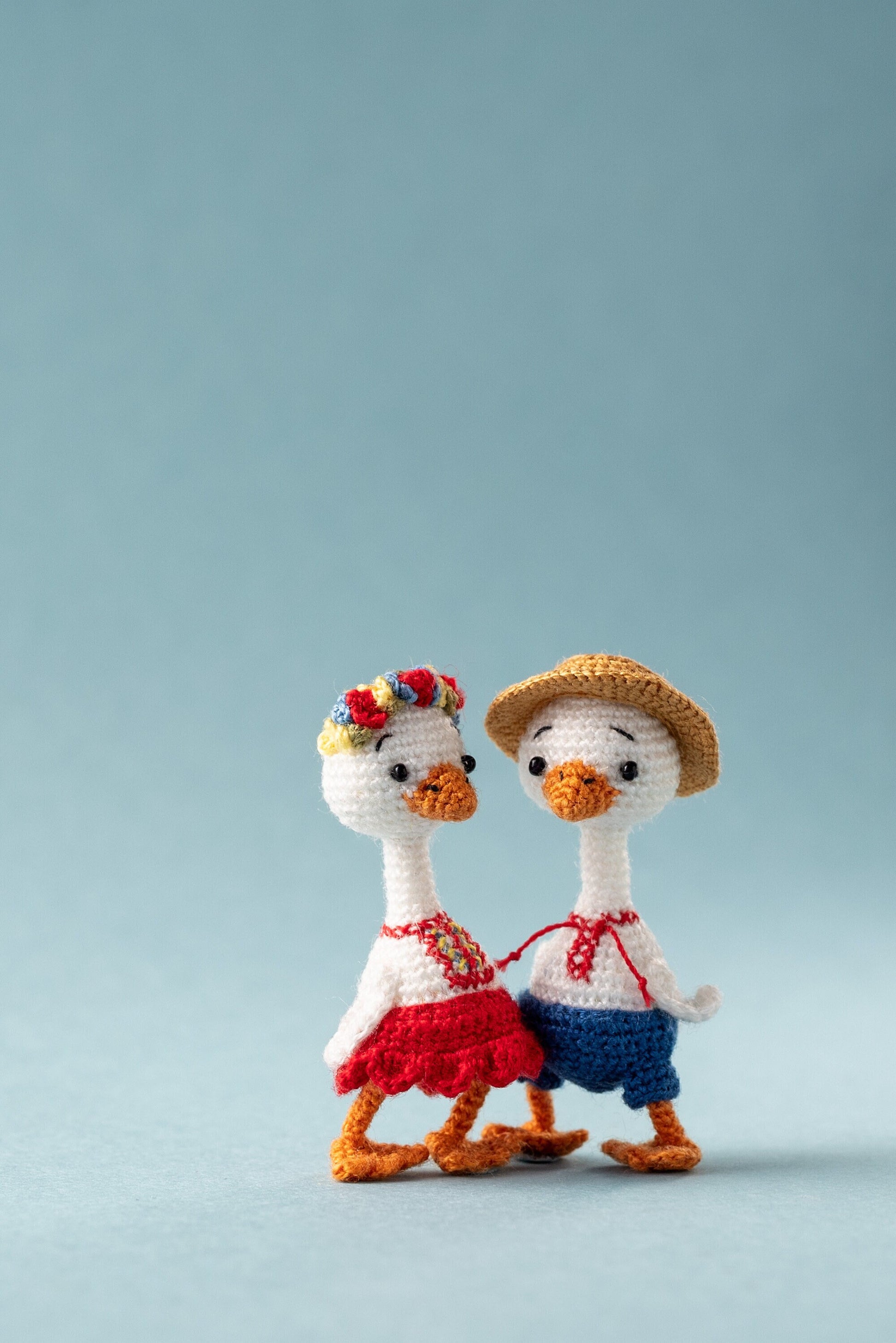 Hand-crocheted goose in traditional dress – soft sculpture art doll for collectors