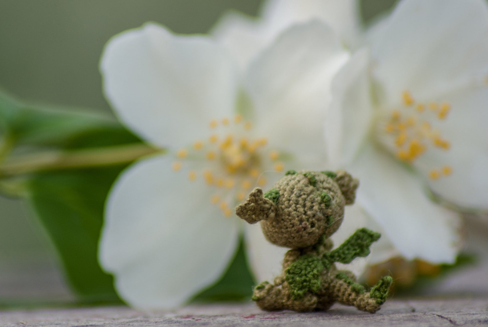 Miniature dragon figurine among natural elements