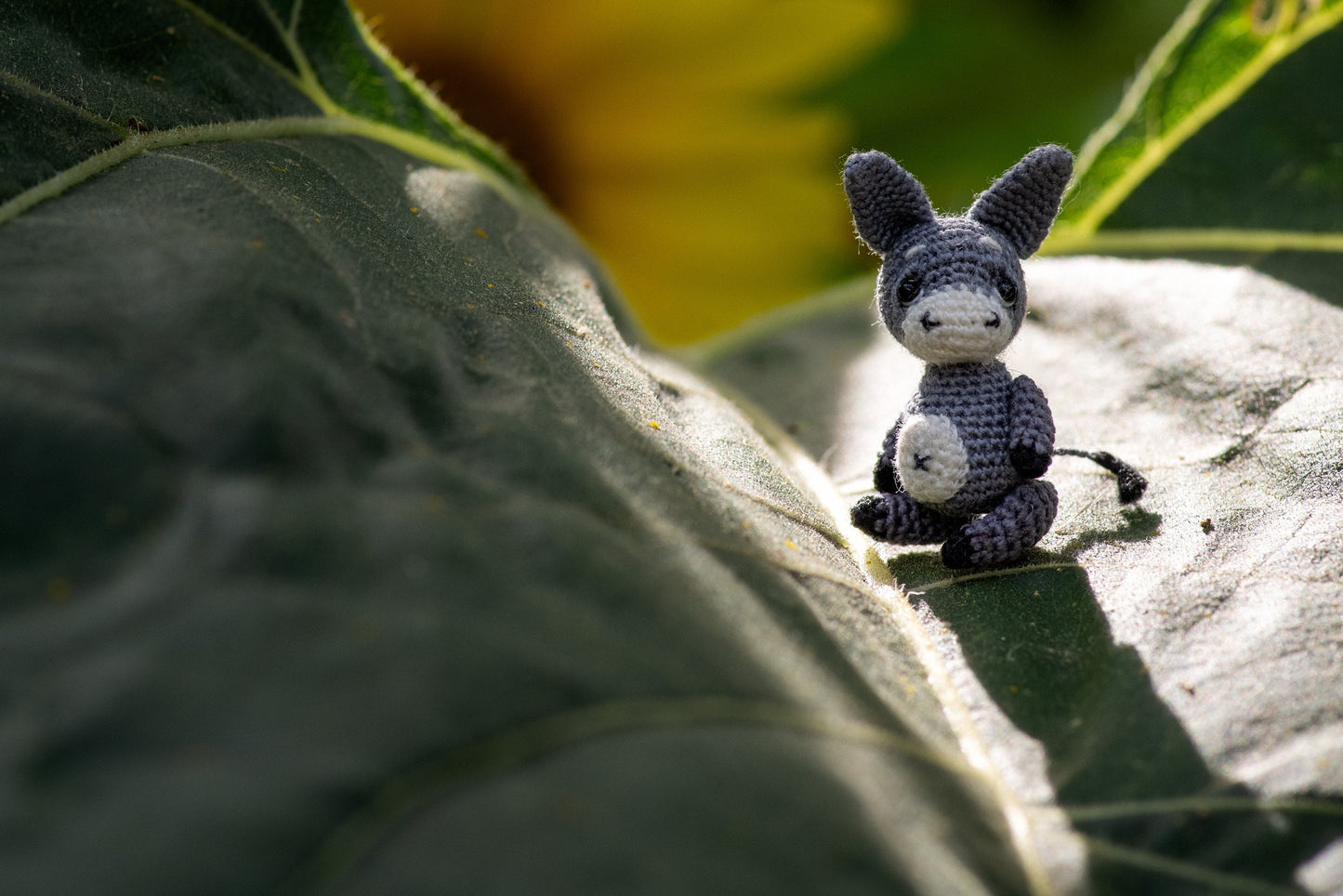 Tiny donkey in walnut shell – TaleWorld micro animal sculpture for display