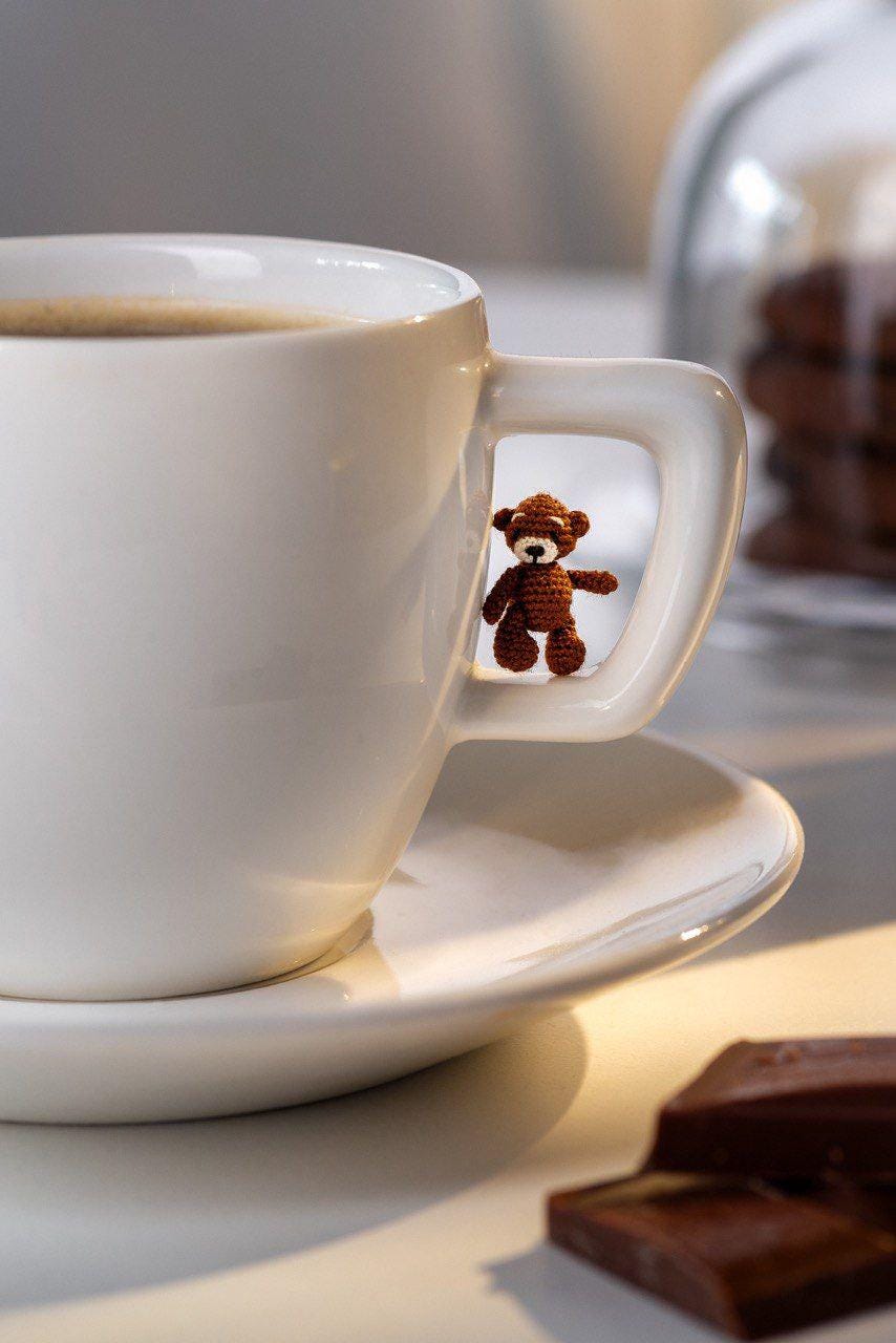 Close-up of tiny teddy bear in hand, perfect for gifting or collecting
