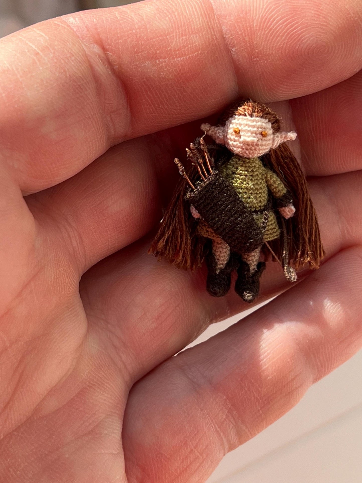 Miniature RPG-style archer with thread-woven details