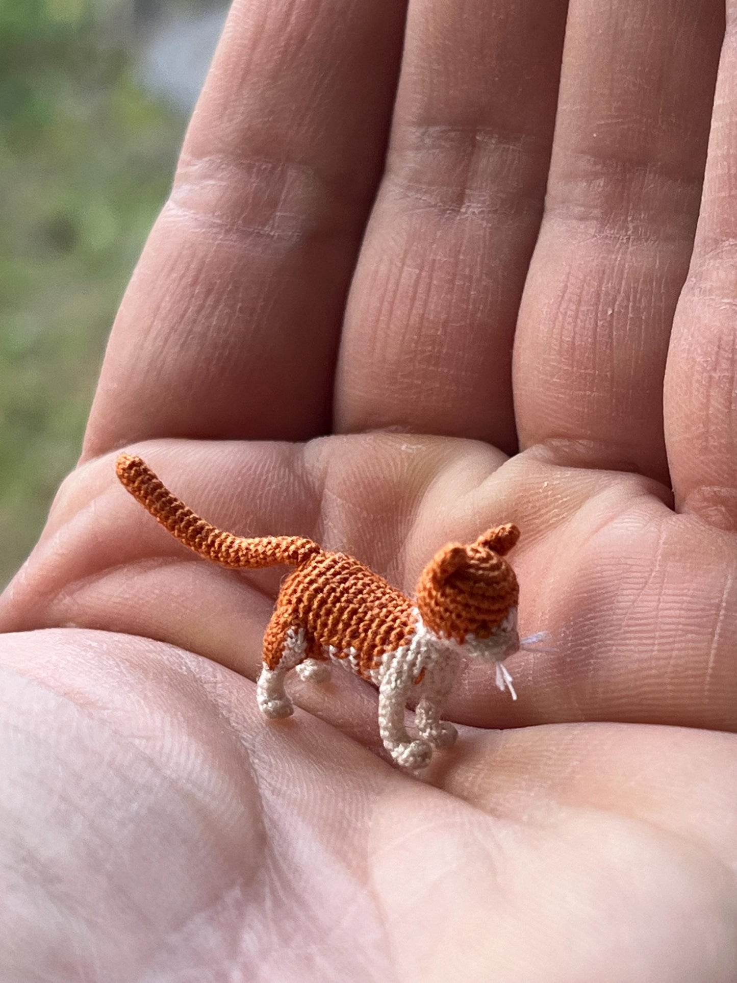 Handmade cat toy in human hand