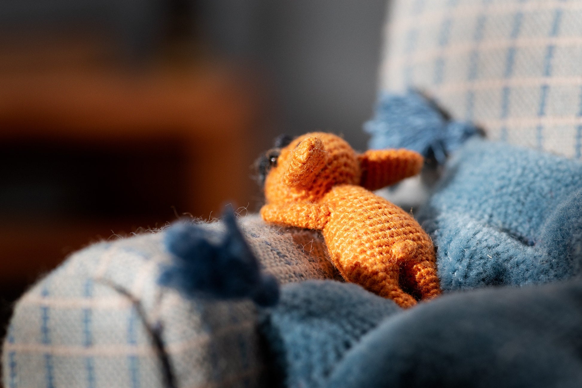 Miniature amigurumi puppy taking a nap
