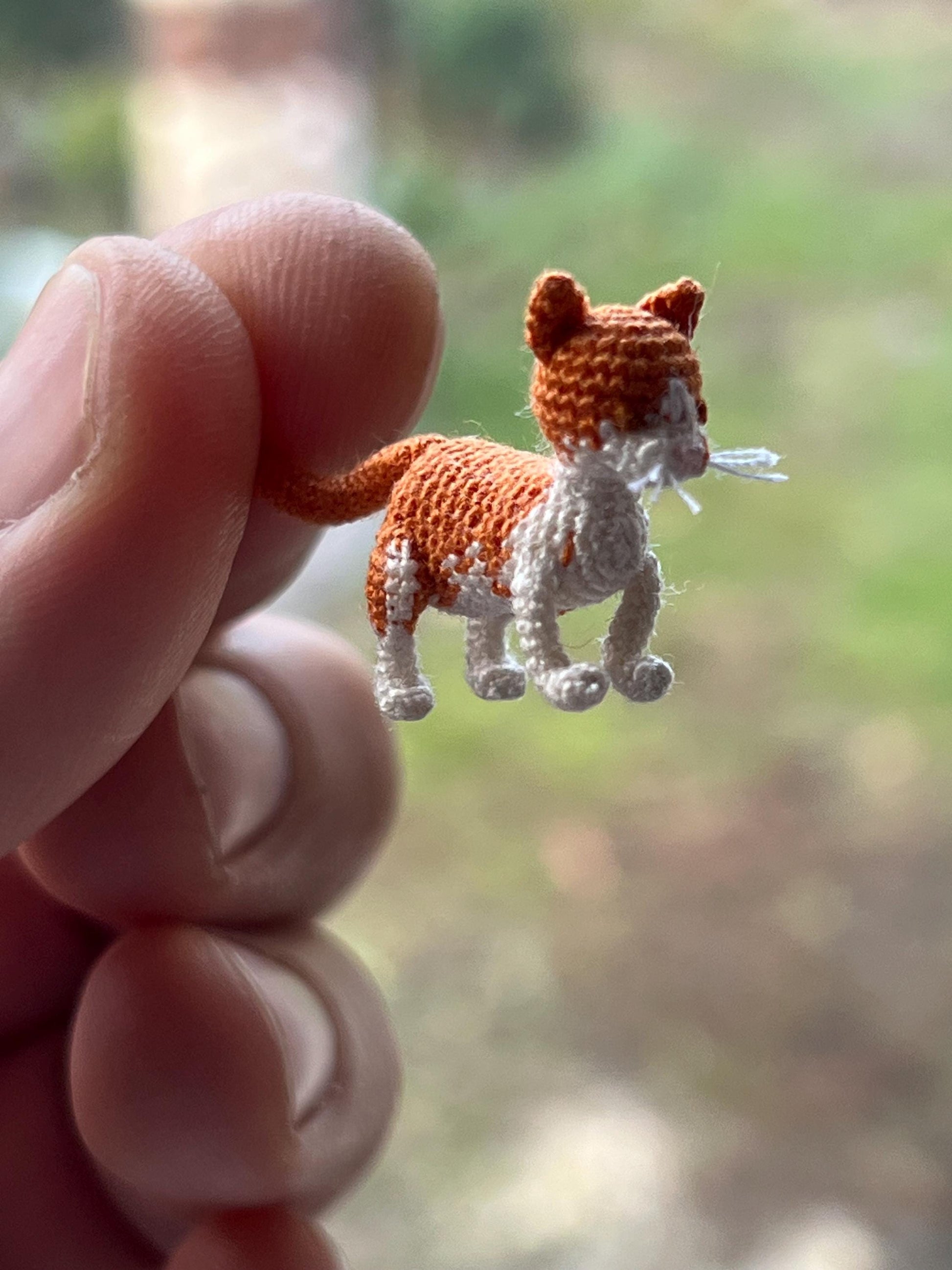 Pocket-sized crochet kitten with stitched tail
