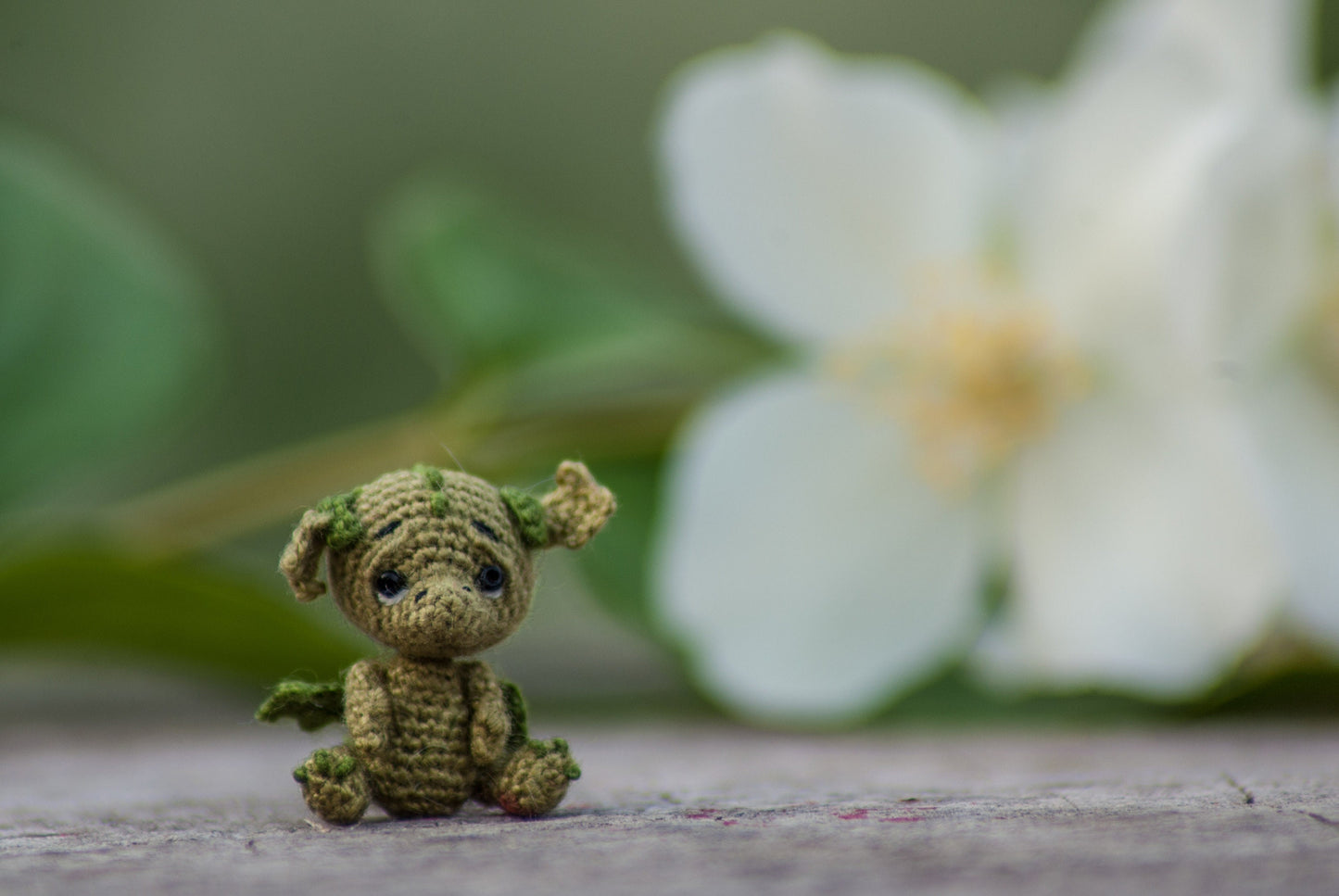 Close-up of crochet dragon details