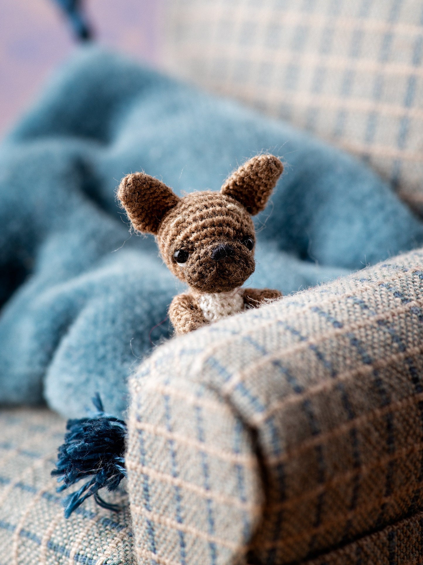  Handmade micro French bulldog toy on textured fabric