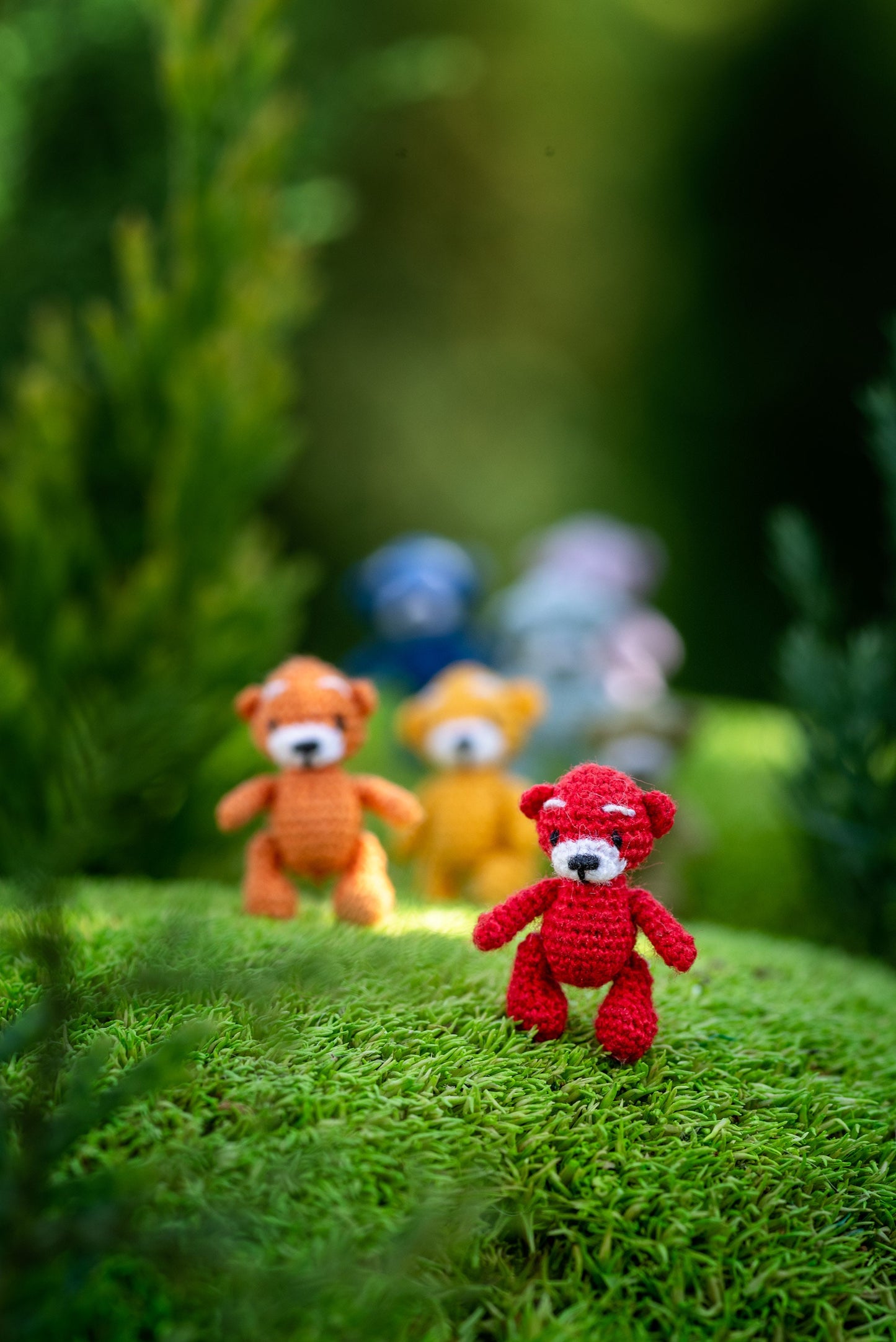 Handmade miniature amigurumi bears in rainbow colors